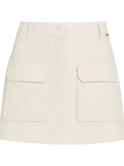 Jupe en coton mélangé beige unie avec une coupe courte et 4 passants