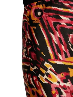 Jupe longue rouge à imprimé multicolore avec une coupe midi fluide