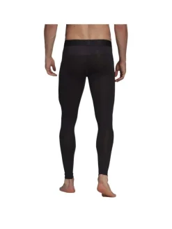 Legging noir coupe skinny avec taille élastiquée et logo floqué sur la cuisse gauche