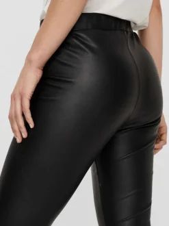 Legging noir uni avec une coupe skinny et une taille élastiquée