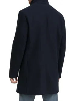 Manteau marine uni avec un col montant et boutonnière à l'avant