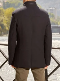Manteau marine uni coupe droite col montant et zippé