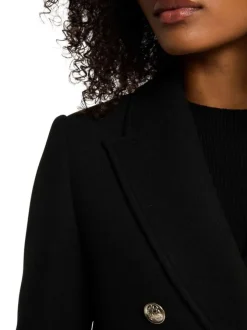 Manteau noir effet lainage pourvu d'un col tailleur et de manches longues