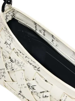 Mini sac en coton blanc avec des imprimés muni d'une anse et d'une bandoulière