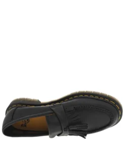 Mocassins noir à semelle à talon plat avec un pompon et des franges