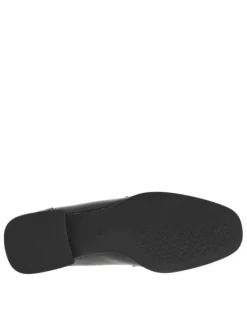 Mocassins noirs en simili cuir avec une boucle décorative et un talon plat
