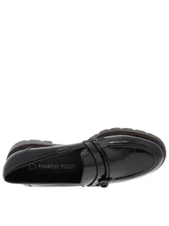 Mocassins noirs vernis à semelle plate avec un bijou à l'avant