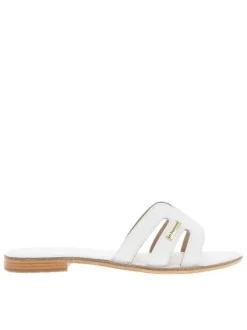 Mules Damia en cuir blanches avec logo métallique et un talon plat