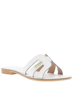 Mules Damia en cuir blanches avec logo métallique et un talon plat