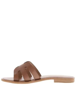 Mules en cuir café à semelle plate avec des surpiqûres ton sur ton