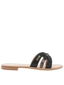 Mules en cuir noires à talon plat avec un aspect tacheté sur les brides avants