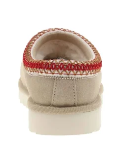Mules en cuir sable avec un logo iconique embossé sur le côté