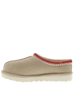 Mules en cuir sable avec un logo iconique embossé sur le côté