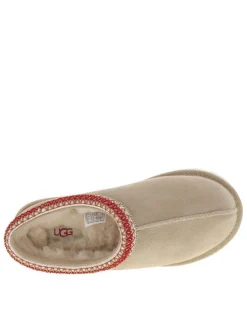 Mules en cuir sable avec un logo iconique embossé sur le côté