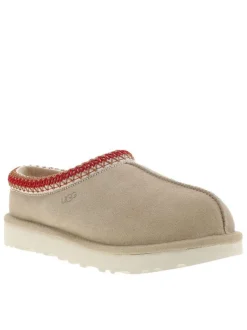 Mules en cuir sable avec un logo iconique embossé sur le côté