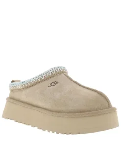 Mules en cuir sable à talon compensé avec logo embossé sur l’avant