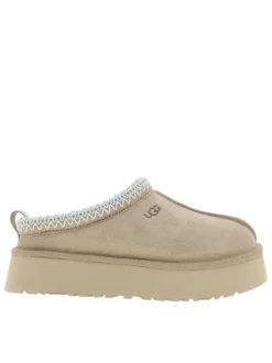 Mules en cuir sable à talon compensé avec logo embossé sur l’avant