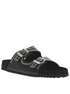 Mules noires à œillets métalliques et à boucles à ardillon sur le côté