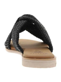 Mules noires à semelle plate avec des brides croisées à l'avant
