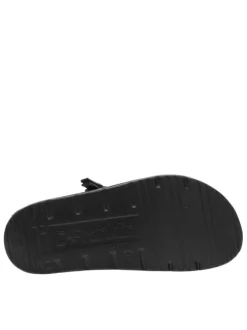 Mules noires à semelle plate et une fermeture à boucle à ardillon