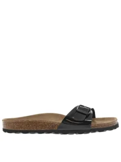 Mules noires vernies avec un aspect liège et une boucle à ardillon sur la bride