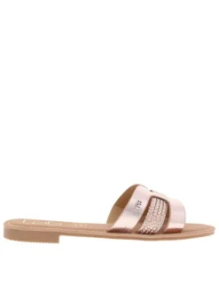 Mules roses métal avec un talon plat et un logo en pièce métallique