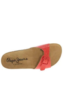 Mules rouges avec une boucle à ardillon et une semelle intérieure en cuir nubuck