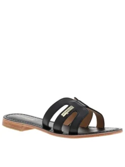 Mules à talon plat Damia noires en cuir avec bride unique sur la tige