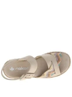 Nu-pieds beiges à semelle compensée et une fermeture à boucle à ardillon