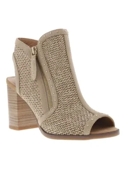 Nu-pieds beiges à talon décroché haut et zip latéral avec détails clous