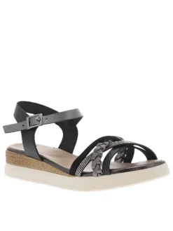 Nu-pieds en cuir noirs à boucle à ardillon avec un talon compensé bas