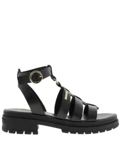 Nu-pieds en cuir noirs à semelle plat et à boucle à ardillon