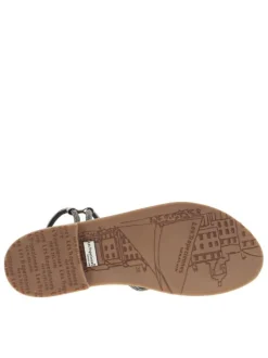 Nu-pieds noirs avec un talon plat des strass et un entre-doigt
