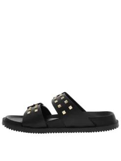Nu-pieds noirs avec un talon plat et 2 boucles à ardillon avec clous
