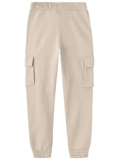 Pantalon beige uni avec une coupe slim et des poches latérales