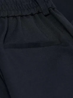 Pantalon Chino marine uni avec une coupe slim et liens à nouer