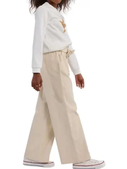 Pantalon en coton écru uni en velours côtelé avec une coupe ample