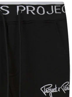 Pantalon jogging noir uni avec une coupe slim et des cordons sur la taille