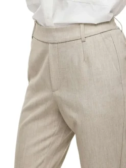 Pantalon beige uni avec une coupe cigarette et une taille intermédiaire
