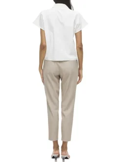 Pantalon beige uni avec une coupe cigarette et une taille intermédiaire