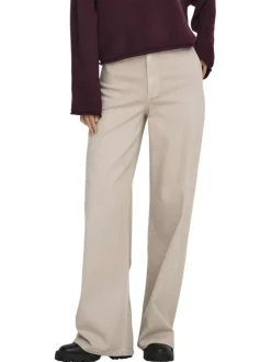 Pantalon beige uni avec une coupe flare avec un zip et un bouton