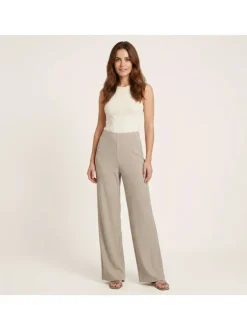 Pantalon beige uni pourvu d'une coupe large et d'une taille haute