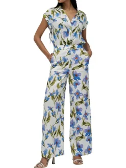 Pantalon blanc à fleurs bleues avec une coupe large et fluide et à taille haute