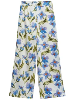 Pantalon blanc à fleurs bleues avec une coupe large et fluide et à taille haute