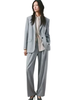 Pantalon bleu gris uni avec une coupe bootcut et une braguette zippée