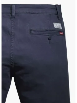 Pantalon bleu marine en coton uni avec poches avant et poches passepoilées arrière