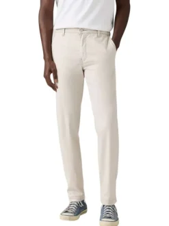 Pantalon chino beige à coupe slim pourvu du patch de la marque