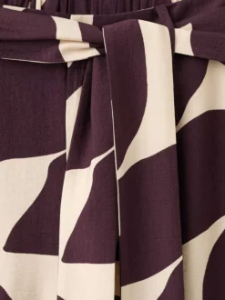Pantalon chino beige à motifs pourvu d'une coupe large et d'une taille haute