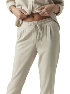 Pantalon Chino beige pourvu d'une coupe droite et d'une taille élastiquée