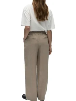 Pantalon chino beige uni pourvu d'une coupe bootcut et d'un bouton à la taille